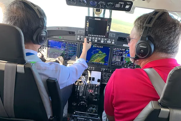 Two men flying a King Air.